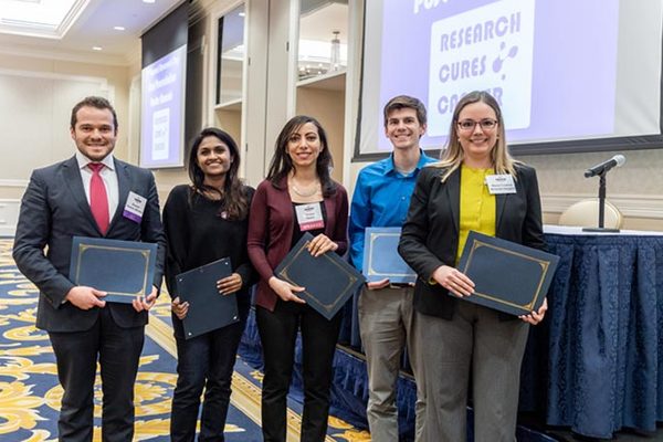Sandhya Vasudevan with other graduate students with their 3rd place prizes during Harper Research Day